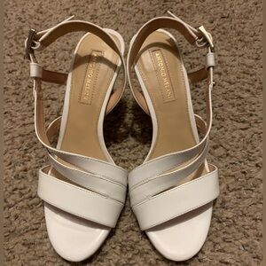 Antonio Melani white low strap heel. Size 5.5 in women’s.